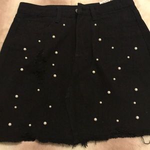 Black denim skirt with white pearls